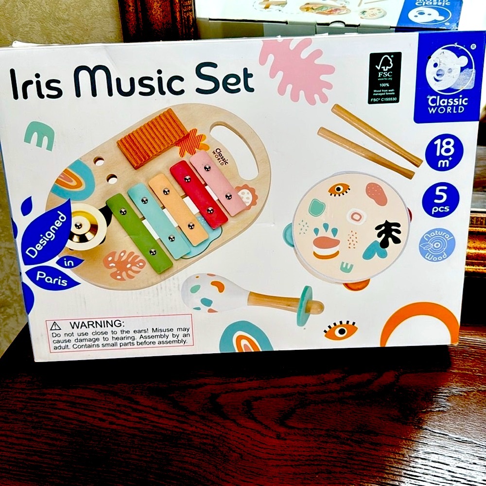 Iris Music Set. Includes music table, maraca, & tambourine. Multicolor wood set.
